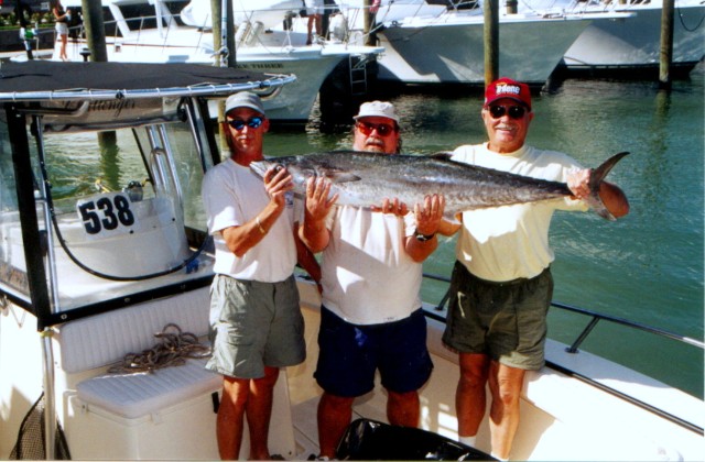 (L-R) Richard Denning, Capt. Jerry and Bob Black with the 40 pound king that sealed the 2001 SKA National Championship win for them.