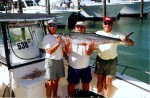 (L-R) Richard Denning, Capt. Jerry and Bob Black with the 40 pound king that sealed the 2001 SKA National Championship win for them.