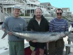 Doug Armstrong (L) and friends with a 92 pound wahoo.